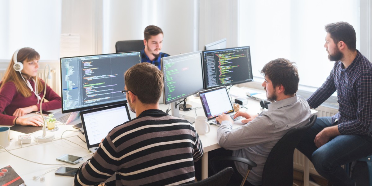 A team of software engineers working in an agile team room