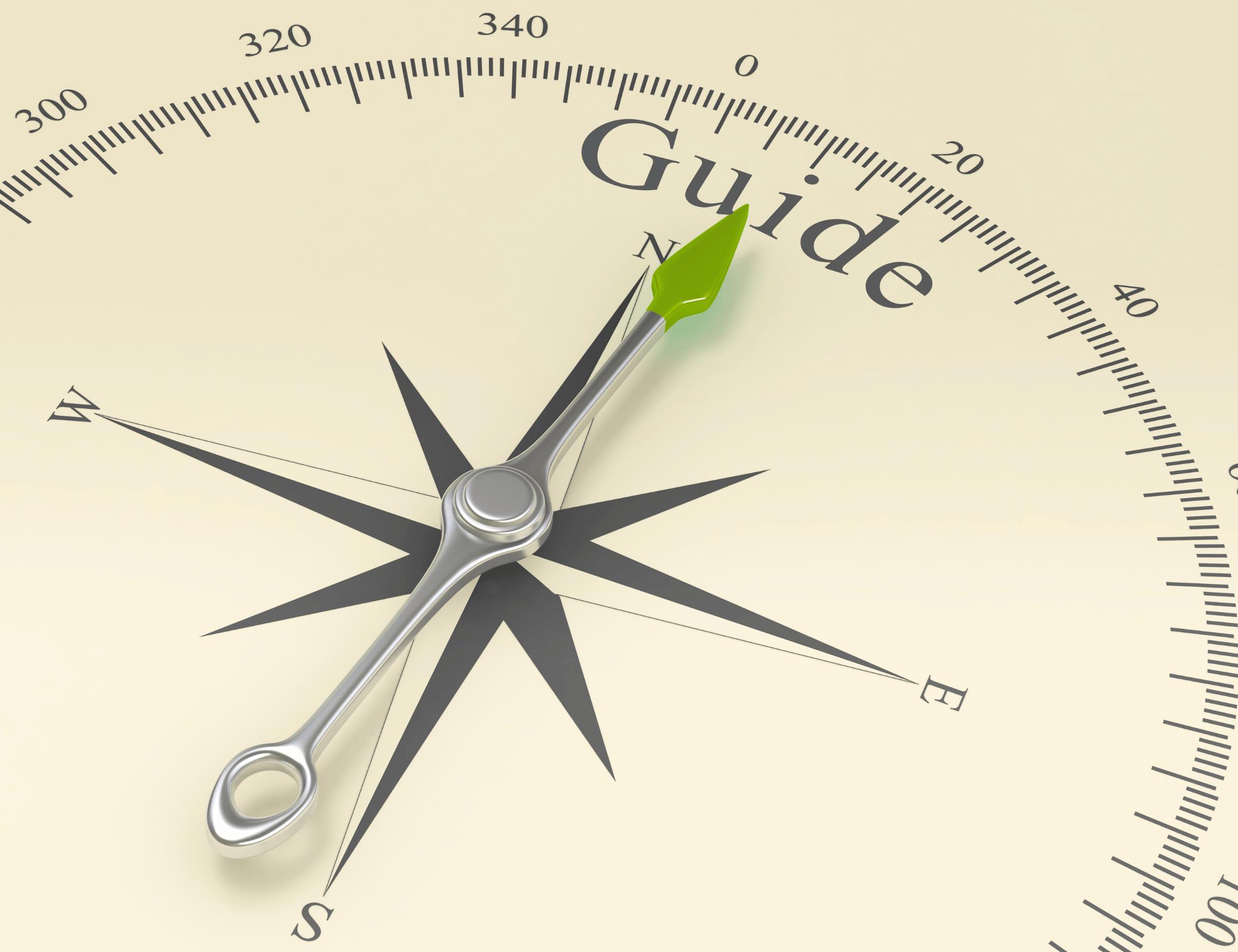 Compass pointing toward the word guide