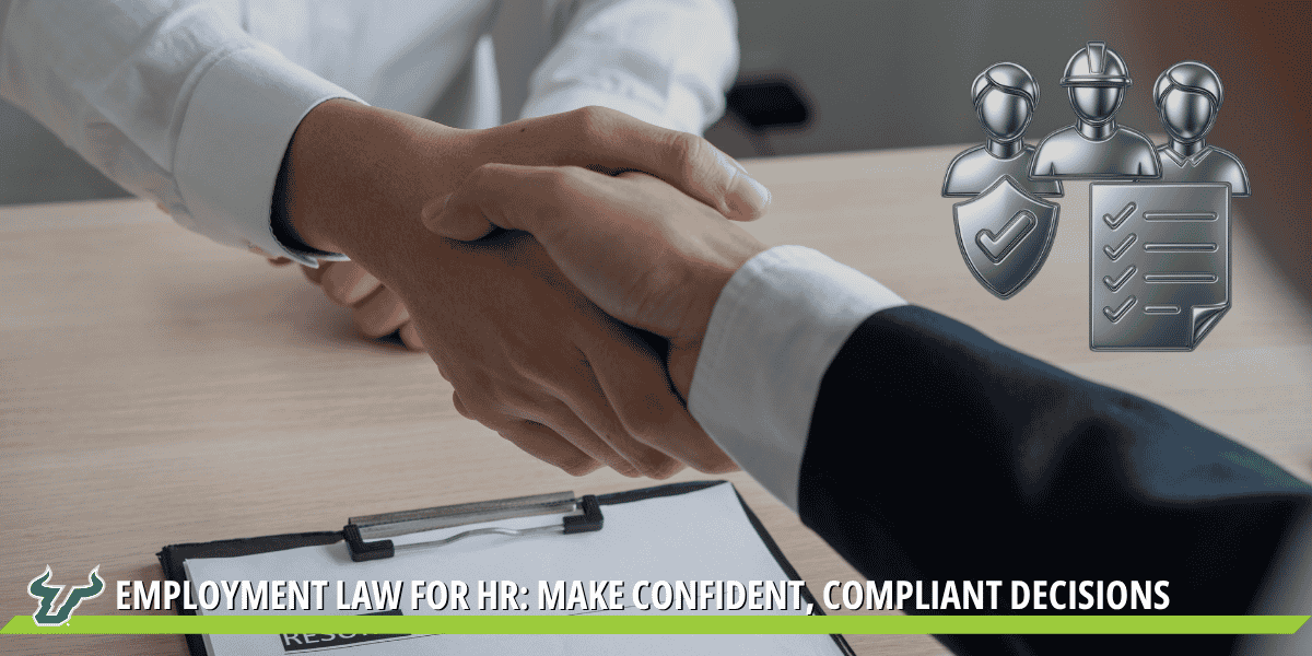 Two professionals shaking hands over a desk
