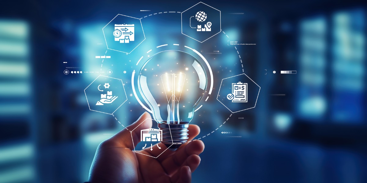 A hand holding a lit up light bulb surrounded by digital images representing a product lifecycle